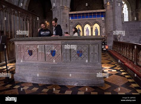 Visitors to the tomb of Edmund Tudor at St.Davids Cathedral (Tyddewi) in Pembrokshire, Wales,UK ...