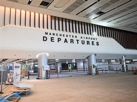 Inside Manchester Airport's Terminal 2 extension - featuring a huge spectacular light feature ...