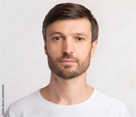 Portrait Of Man Looking At Camera Over White Background Stock Photo ...