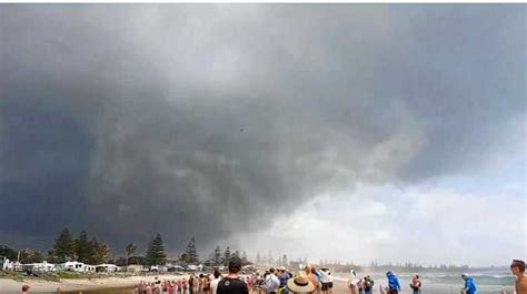 WATCH: Mini sand tornado sends nippers fleeing | Tweed Daily News