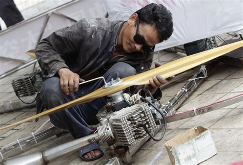 China: Awesome gentleman builds homemade flying contraption powered by ...