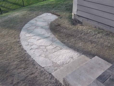 A natural flagstone walkway with two 400 lbs limestone steps incorporated - Jonathan Allen Landscape