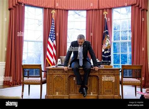 Collectables President Barack Obama tries out desk chairs in the Oval ...