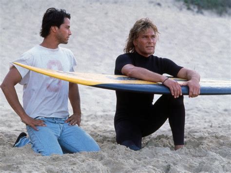 point-break-1991-002-keanu-reeves-patrick-swayze-surfing-board-sandy-beach_0 - 30A