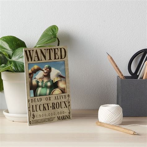 an old wanted poster on a table next to a potted plant art board print