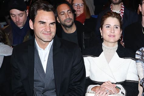 Mirka Federer Slips On Shiny Boots for Chanel Show With Roger Federer ...