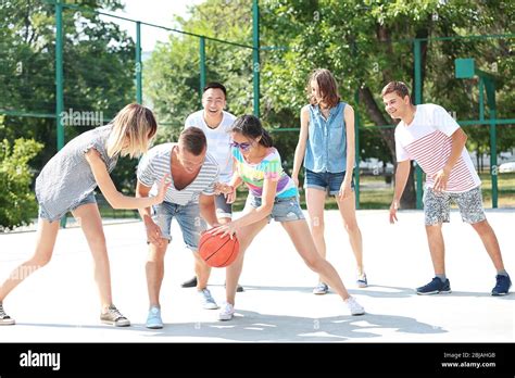 Teenagers playing basketball Stock Photo - Alamy