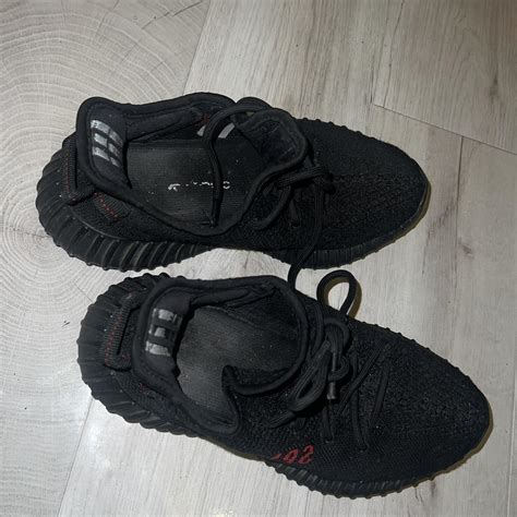 Black yeezy 350 Worn alot so a lot of signs of... - Depop