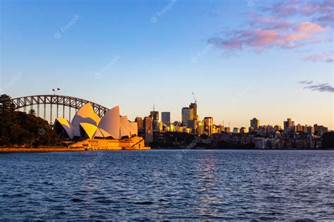 Premium Photo | Sydney skyline at sunrise sunrise overlooking famous building and bridge in ...
