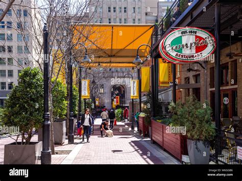 Dallas, TX / USA - March 16, 2019 - People walking past the alley ...