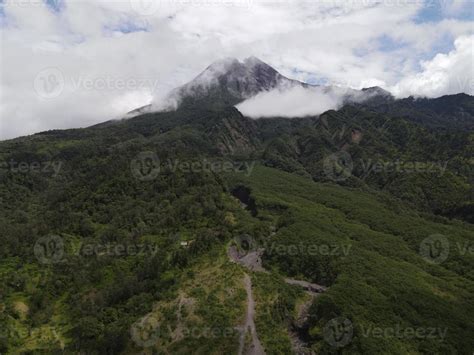 Aerial view of active Merapi mountain with clear sky in Indonesia 7845804 Stock Photo at Vecteezy