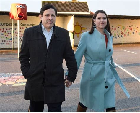 Jo Swinson looks nervous as she arrives to vote hand in hand with her partner | Politics | News ...