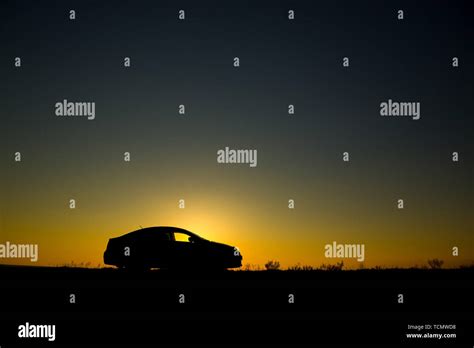 Silhouette of sedan car on the background of beautiful sunset Stock ...