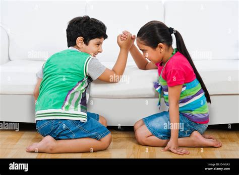 Two girls arm wrestling hi-res stock photography and images - Alamy