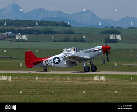 The North American P-51 Mustang WWII fighter, bomber aircraft taxiing at Springbank Airport on ...