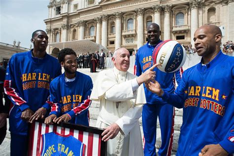 Pope Francis shows off his terrible basketball skills as he meets the Harlem Globetrotters in St ...