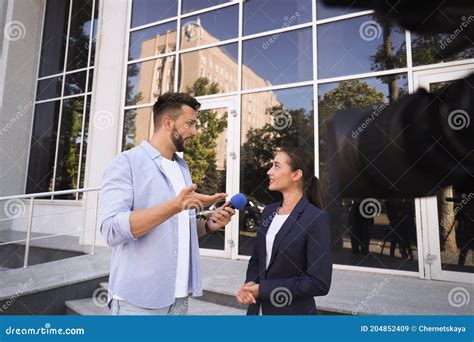 Professional Journalist Taking Interview in Front of Video Camera ...