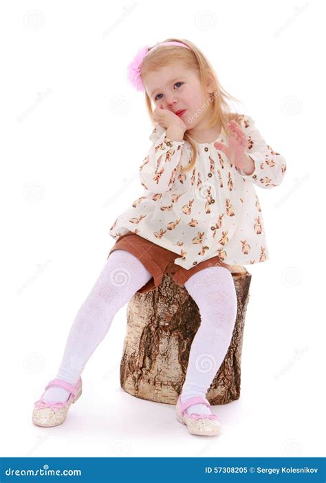 Girl sitting on a stump stock image. Image of childhood - 57308205