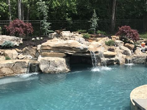 Pool Waterfalls: Pros, Cons, and Everything You Need To Know - Peek Pools & Spas Custom Pool News