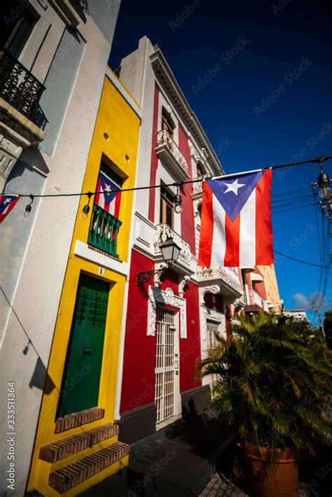 The Puerto Rican flag flies on a sunny day in the colorful Viejo San ...