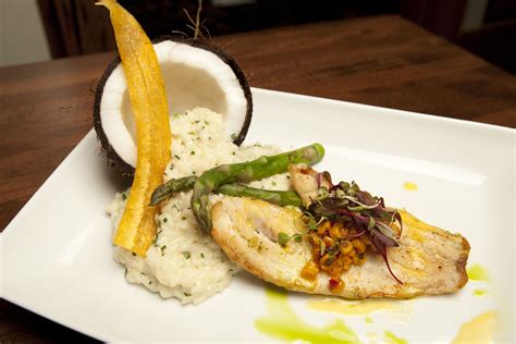 Yellowtail Snapper creamy coconut risotto, mango ginger sauce, asparagus, grilled corn and ...