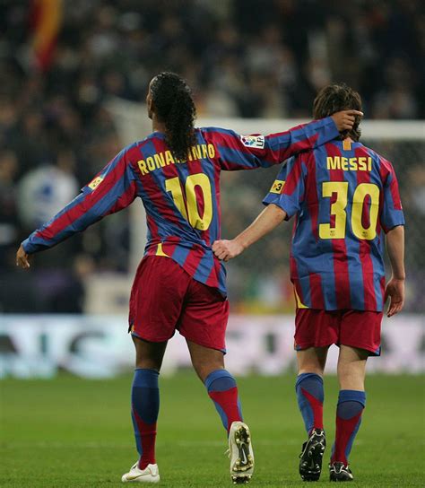 MADRID, SPAIN - NOVEMBER 19: Ronaldinho (L) of Barcelona celebrates ...