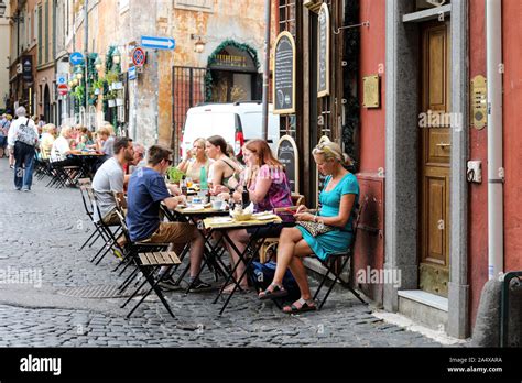 Outdoor seating of an Italian restaurant in Rome, Italy Stock Photo - Alamy