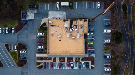 Premium Photo | Aerial view of cars on road in parking lot