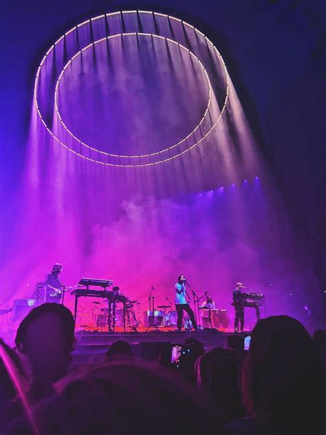 a group of people standing on top of a stage