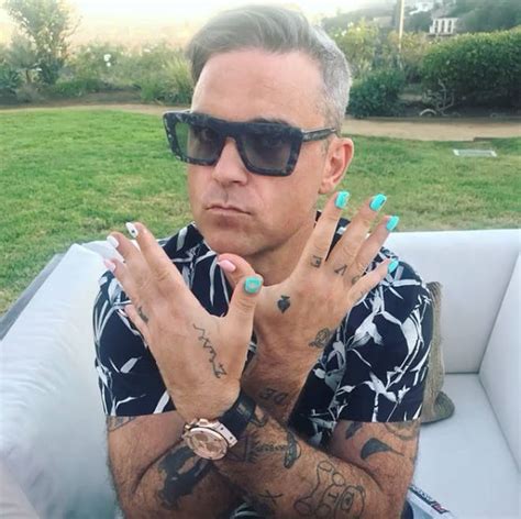 Robbie Williams tattoos: From two pairs of glasses to matching with Louis Tomlinson - Heart