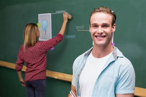 Premium Photo | Creative business people at work against blackboard