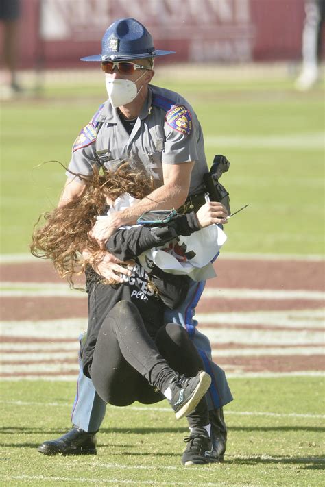 Mississippi State fans ring cowbells as protestors tackled, dragged off the field in Starkville