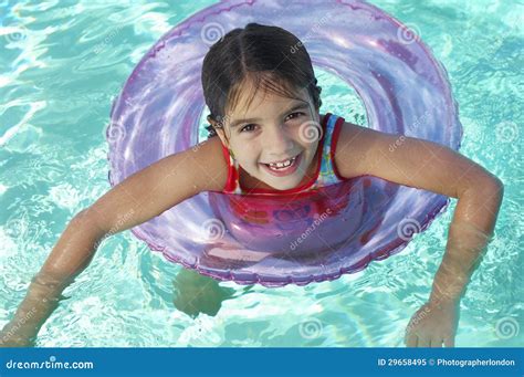 Girl Floating on Inflatable Raft in Swimming Pool Stock Image - Image of happiness, elementary ...