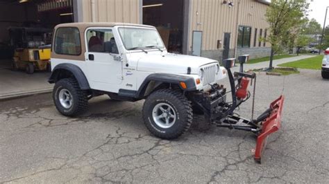 Snow Plowing 1998 Jeep Wrangler - 1J4FY19S7WP723500