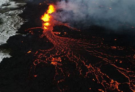 Lava flows from Iceland volcano continues to decrease | Reuters