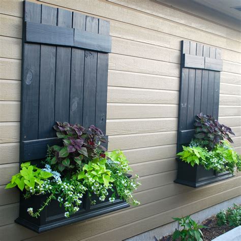 Not best example but had a mad idea to use old shutters on the road facing gable upstairs ...