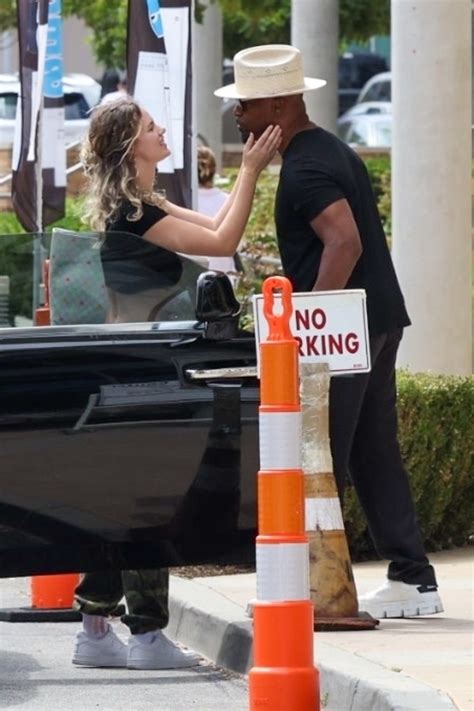 Jamie Foxx and girlfriend Alyce Huckstepp kiss while shopping