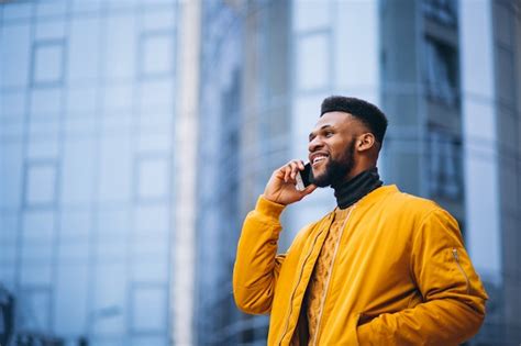 Free Photo | African american student walking in the street and talking ...