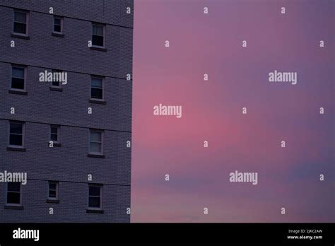 Pink Stratus clouds sunset sky behind the residential building with ...