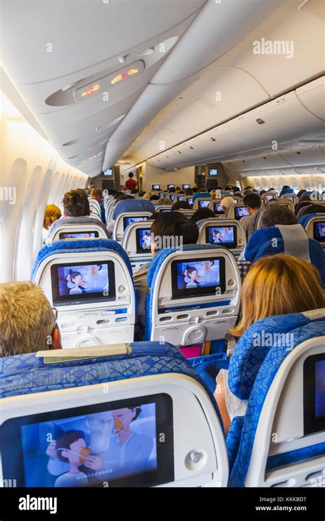 Aeroplane Inflight Cabin and Passengers Stock Photo - Alamy