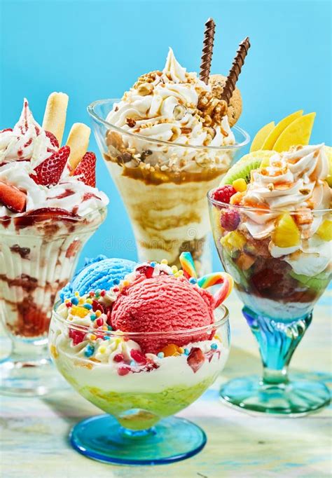 Three Delicious Ice Cream Sundaes on Table Stock Image - Image of ...