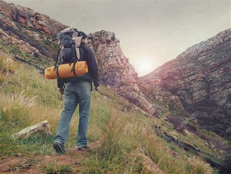 man hiking wilderness mountain with backpack — Stock Photo © Daxiao_Productions #75001481