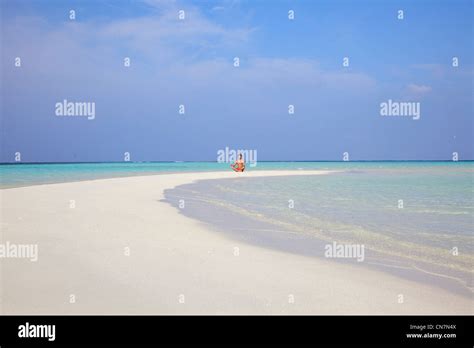 Man meditating on tropical beach Stock Photo - Alamy