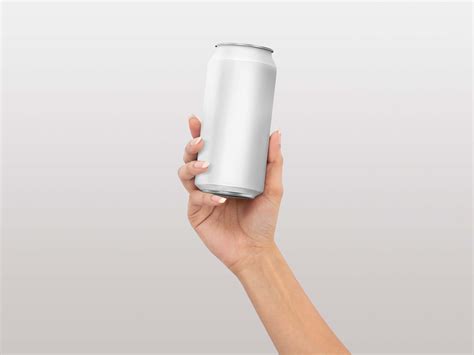 Free Soda Can in Hand Mockup (PSD)