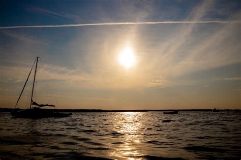 Premium Photo | Fishing boat at the lake on sunset.