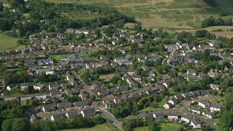 5.5K stock footage aerial video of an orbit of the Scottish village of ...