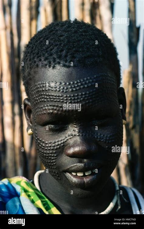 Young Nuer woman with ornamental scarification on her face, South Sudan ...