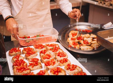 Italian chef cooking traditional bruschette in gourmet restaurant Stock Photo - Alamy