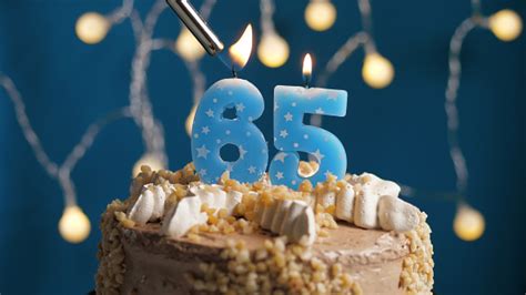 Birthday Cake With 65 Number Candle On Blue Backgraund Set On Fire By ...