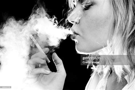 Young Woman Smoking Cigarette Black And White High-Res Stock Photo - Getty Images